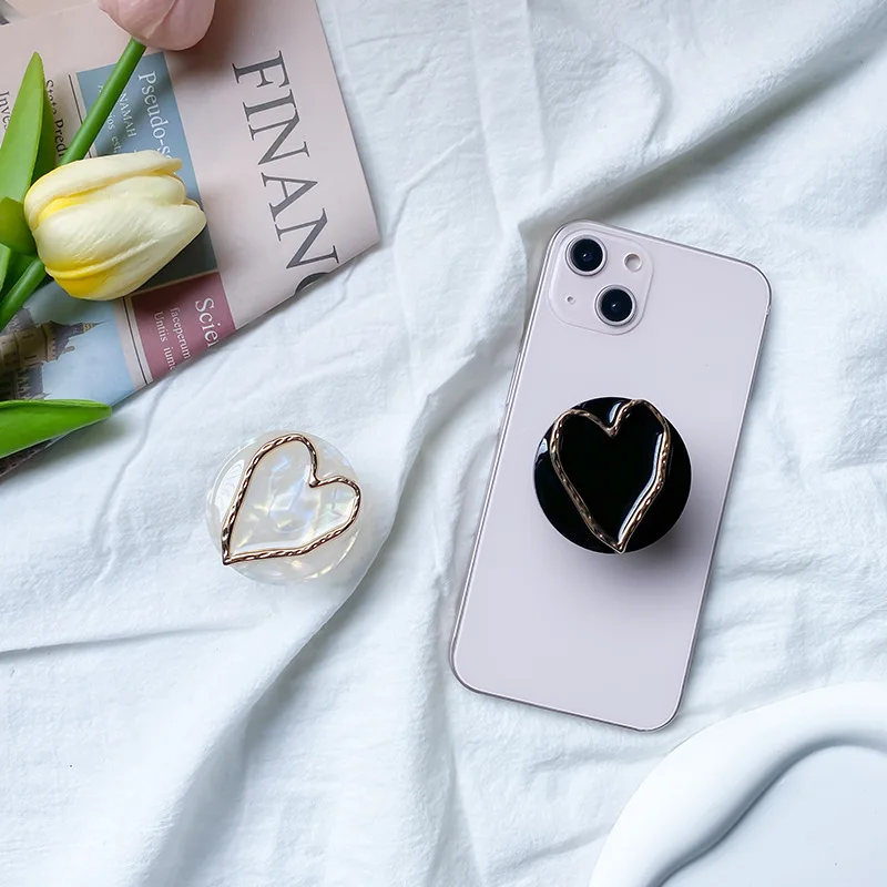 

1pcs.Marble mobile phone holder Electroplated hollow heart paste type retractable foldable desktop support phone Grip Top