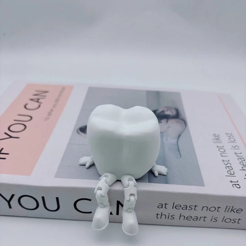 

Декоративные скульптуры зубов из пластика