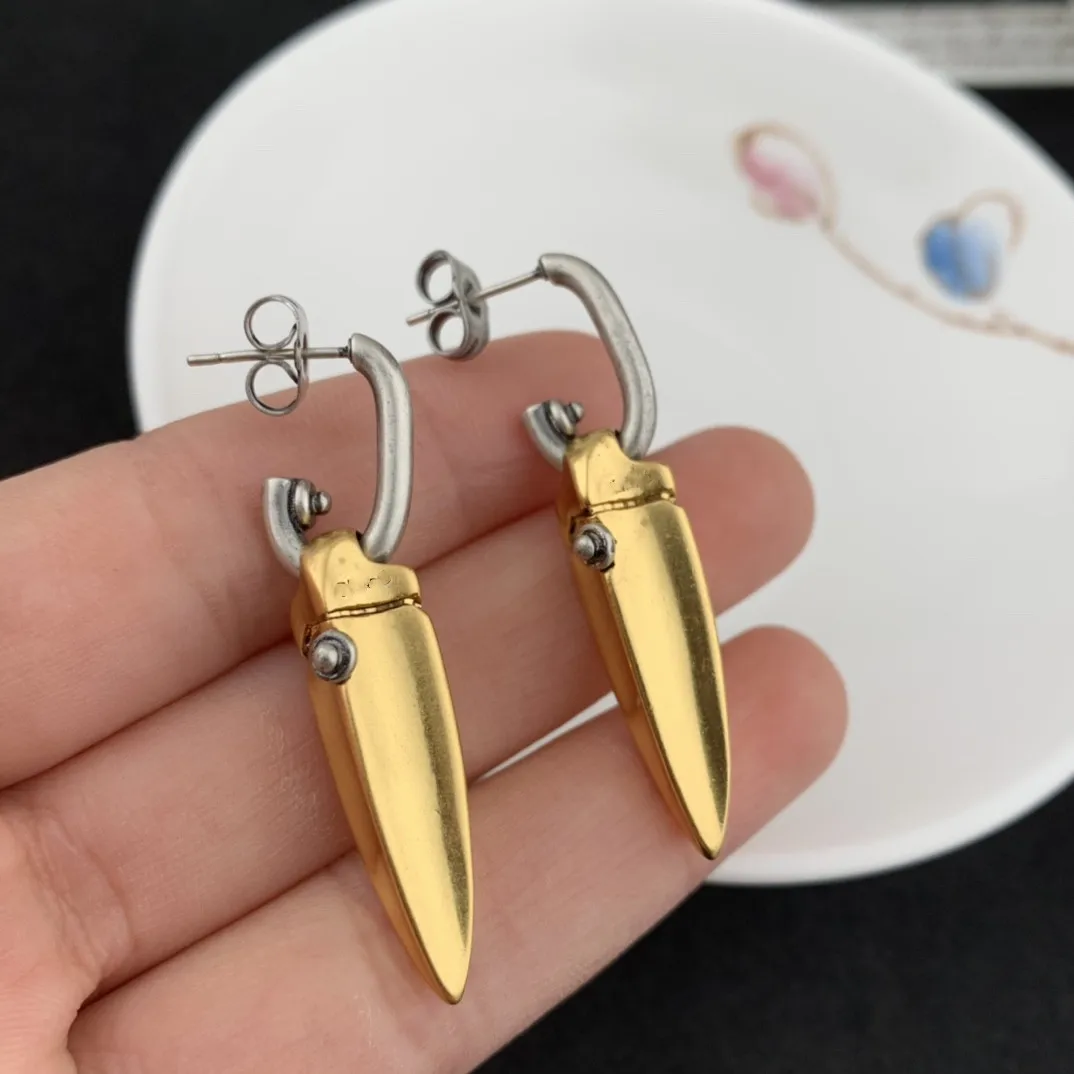 

European and American popular bullet two-color earrings
