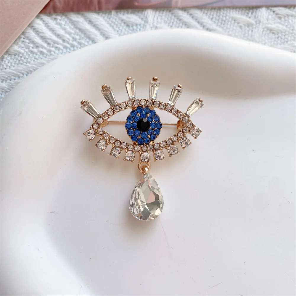Фото Изысканный драгоценный камень CZ, полые синие злые глаза, хрустальная подвеска, женская брошь, модные роскошные металлические булавки с цирконием, женские ювелирные аксессуары №5