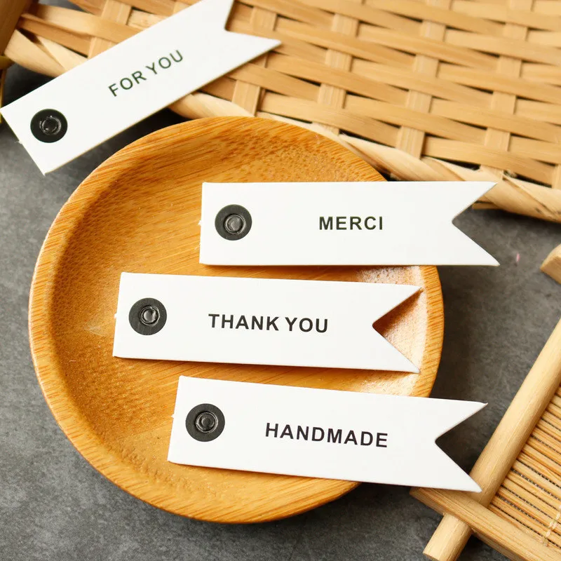 

50pcs/Lot Merci Handmade White Labels For You Gift Packaging Christmas Decoration Flag Shaped Thank You Tags For Business