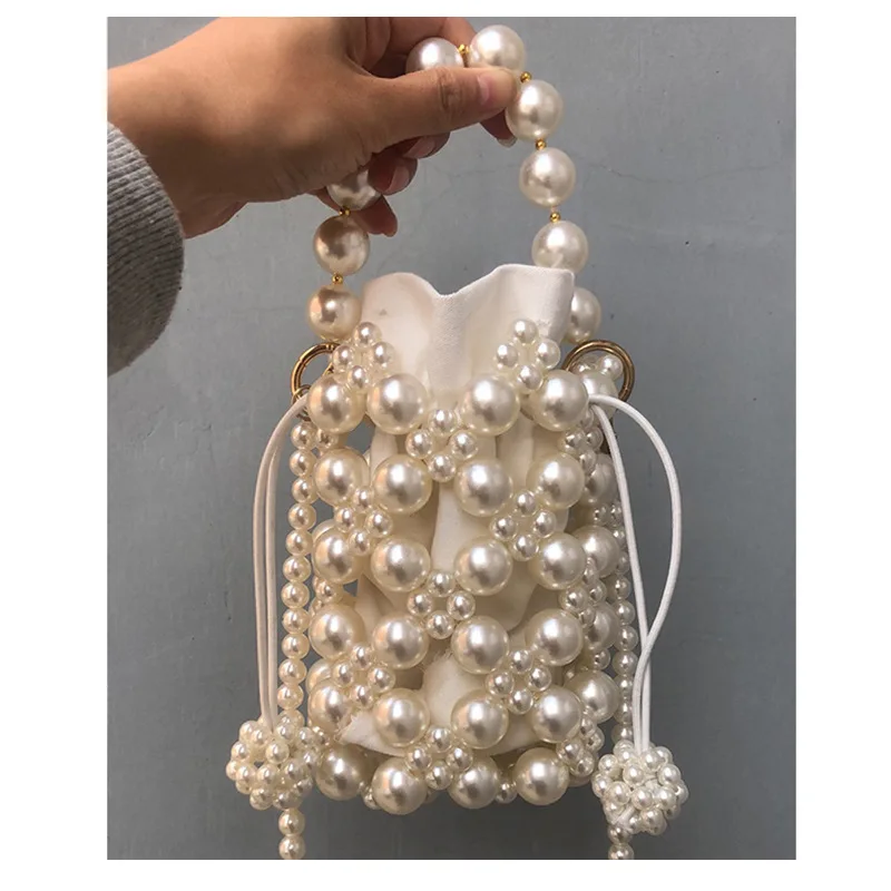 

Handmade Faux Pearl Weaving Drawstring Handbag Hollow Out Pearl Chain Totes Bag Women 2022 Luxury Pearl Shoulder Evening Bags