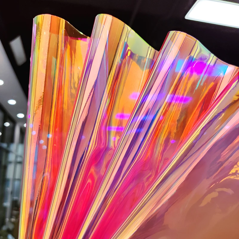 

Magic Bright Materials Colorful PVC Transparent Holographic Faux Leather Fabric For Upholstery Umbrellas Stationery Case Crafts