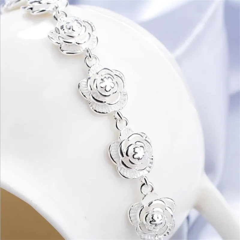 Фото Роскошные дизайнерские ювелирные наборы из серебра 925 пробы: кулоны в виде цветов, ожерелья, серьги, браслеты для женщин, подарочные аксессуары из бутика. №4
