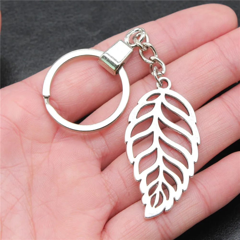 Сувениры, подарок, античный Серебристый Брелок 26x50 мм с полыми листьями