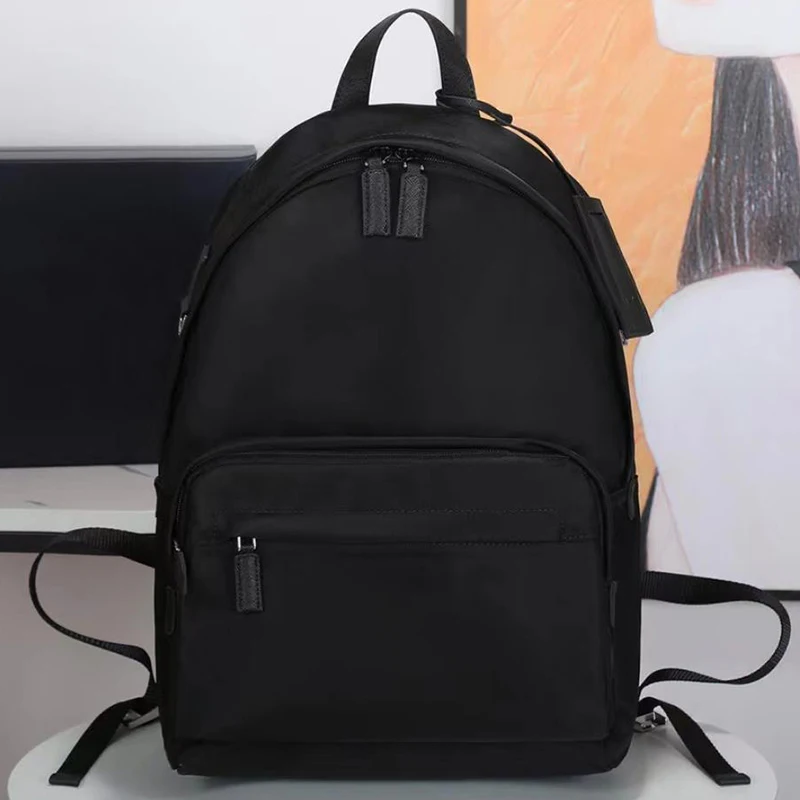 

Новый стильный весенне-летний новый высококачественный позолоченный металлический простой дорожный женский/мужской водонепроницаемый нейлоновый рюкзак