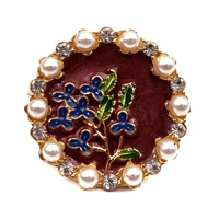 retro antique burgundy red background enamel blue iris flower bouquet round badge pin with pearl accent floral collar jewelry