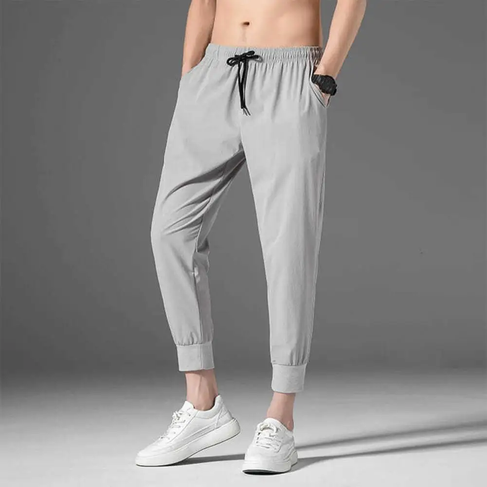 

No Fading Men Pants Non-pilling Summer Lace-up Pockets Men Sweatpants Drawstring Strap Solid Color Casual Pants Daily Wear