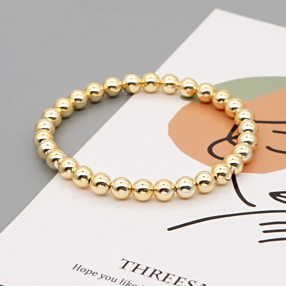 Женский браслет из акрила с позолоченными золотыми шариками в богемном стиле