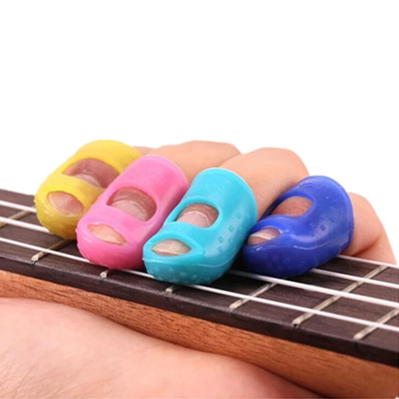 

NEW 5Pcs Silicone Guitar Thumb Finger Picks Protector Plectrum Fingertip thimble Finger Guard safety protect caps Colors Random