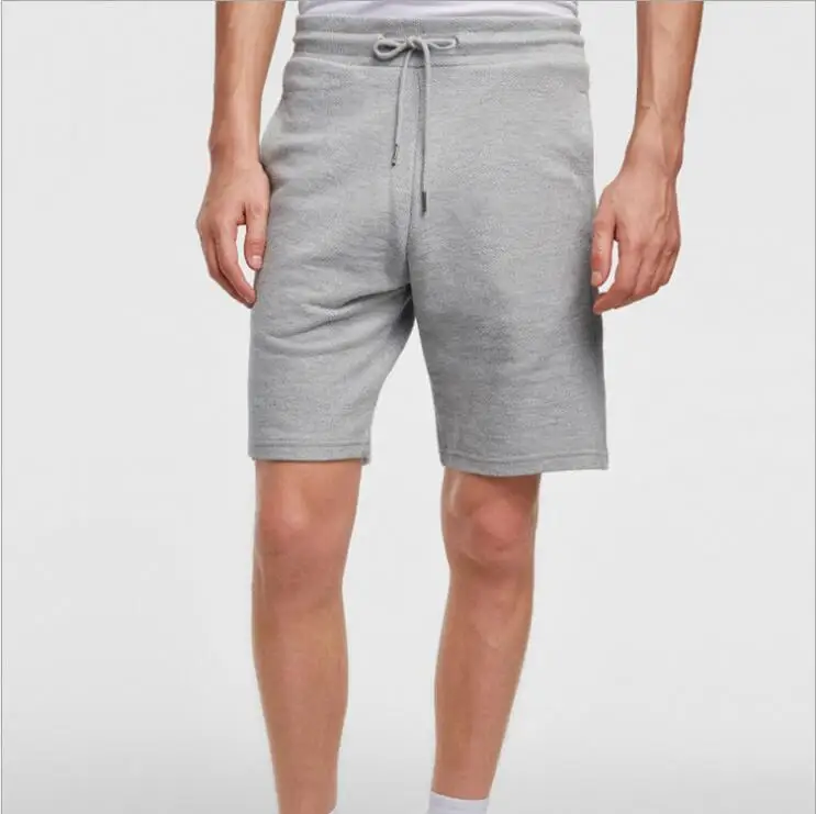 In the summer   of 2018, the basic cotton drawstring shorts for men of various colors will be worn