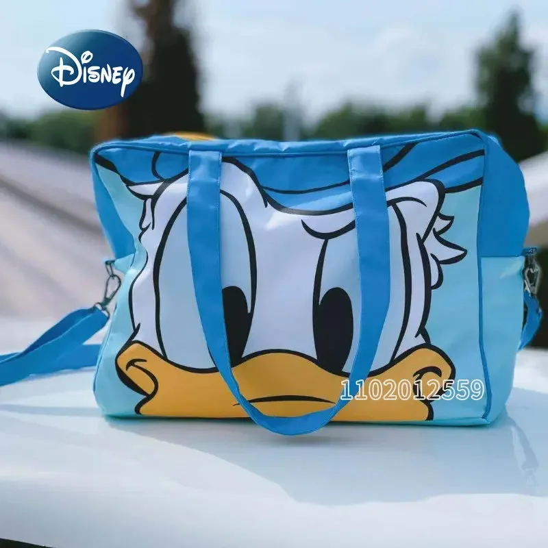 Фото Новая Женская дорожная сумка Disney «Дональд Дак», мультяшный портативный дорожный мешок, вместительная водонепроницаемая сумка для хранения №2