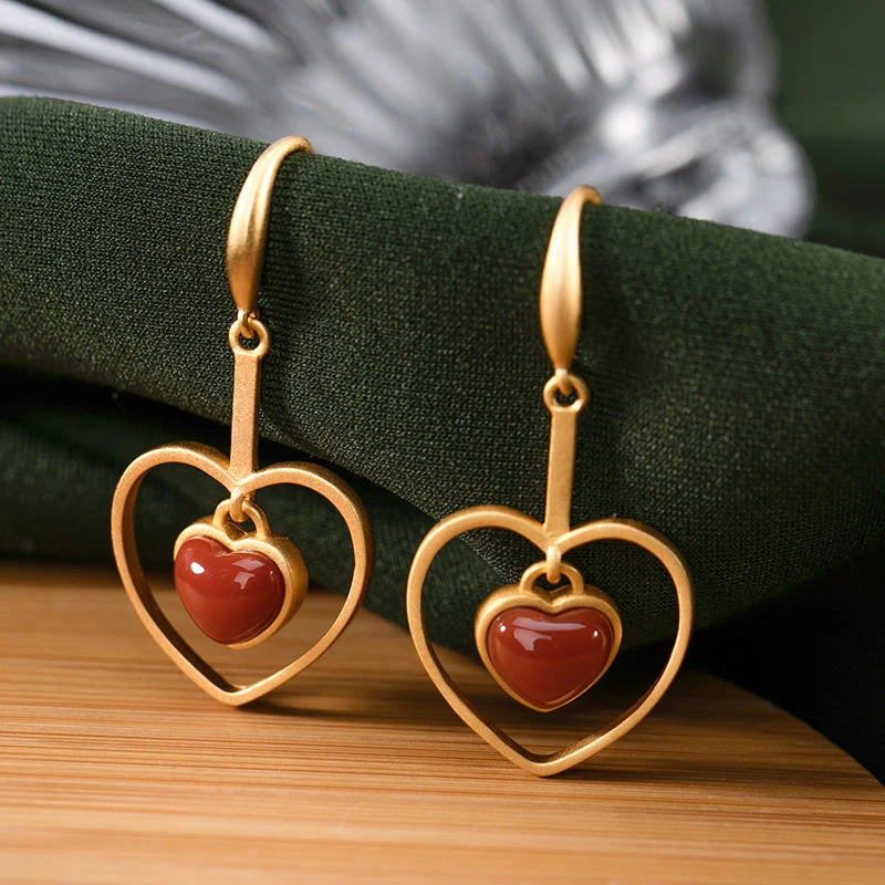 

Creative design inlaid new southern red tourmaline hollow heart earrings for women delicate and elegant silver jewelry