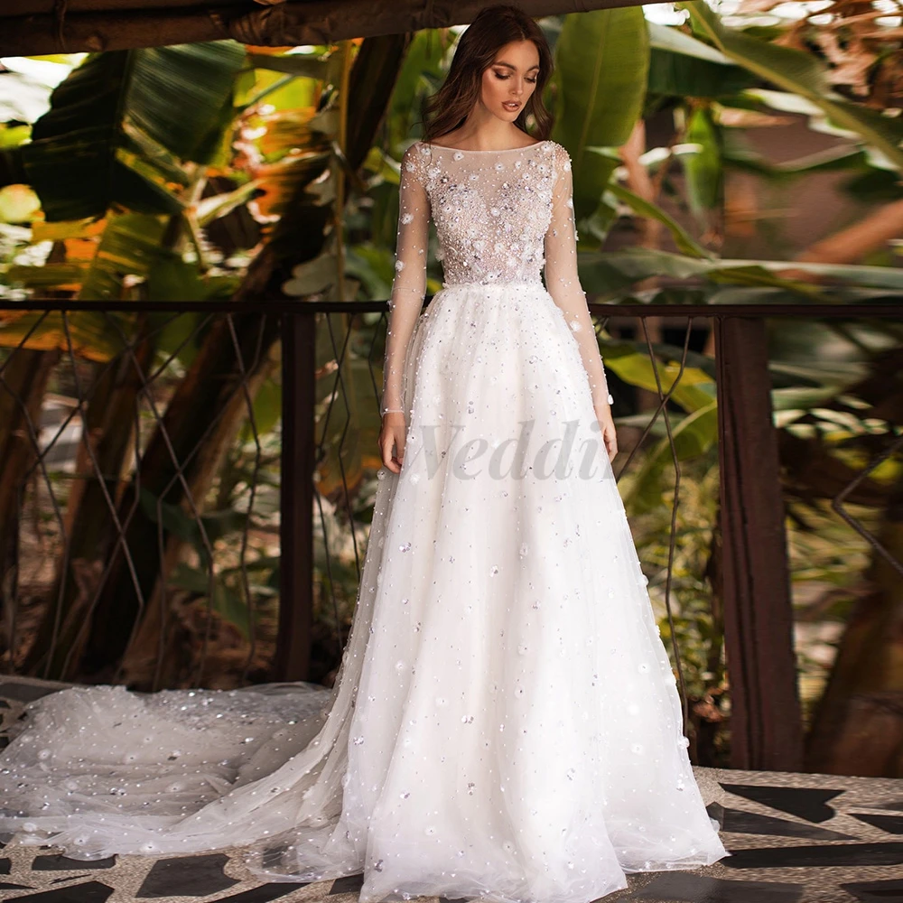 

Exquisite A-Line Wedding Dresses Women Tulle with Applique Sequins Beads Pearls Button Back Long Sleeve Boat Neck Court Train