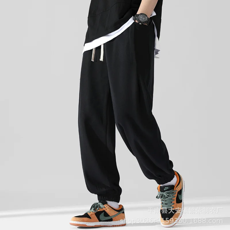 Men's sports pants with loose feet Joker pants trend simple solid color breathable casual pants