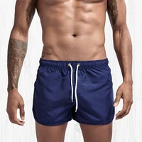 mens summer casual shorts mens seaside sports pants jogging shorts solid color quarter pants