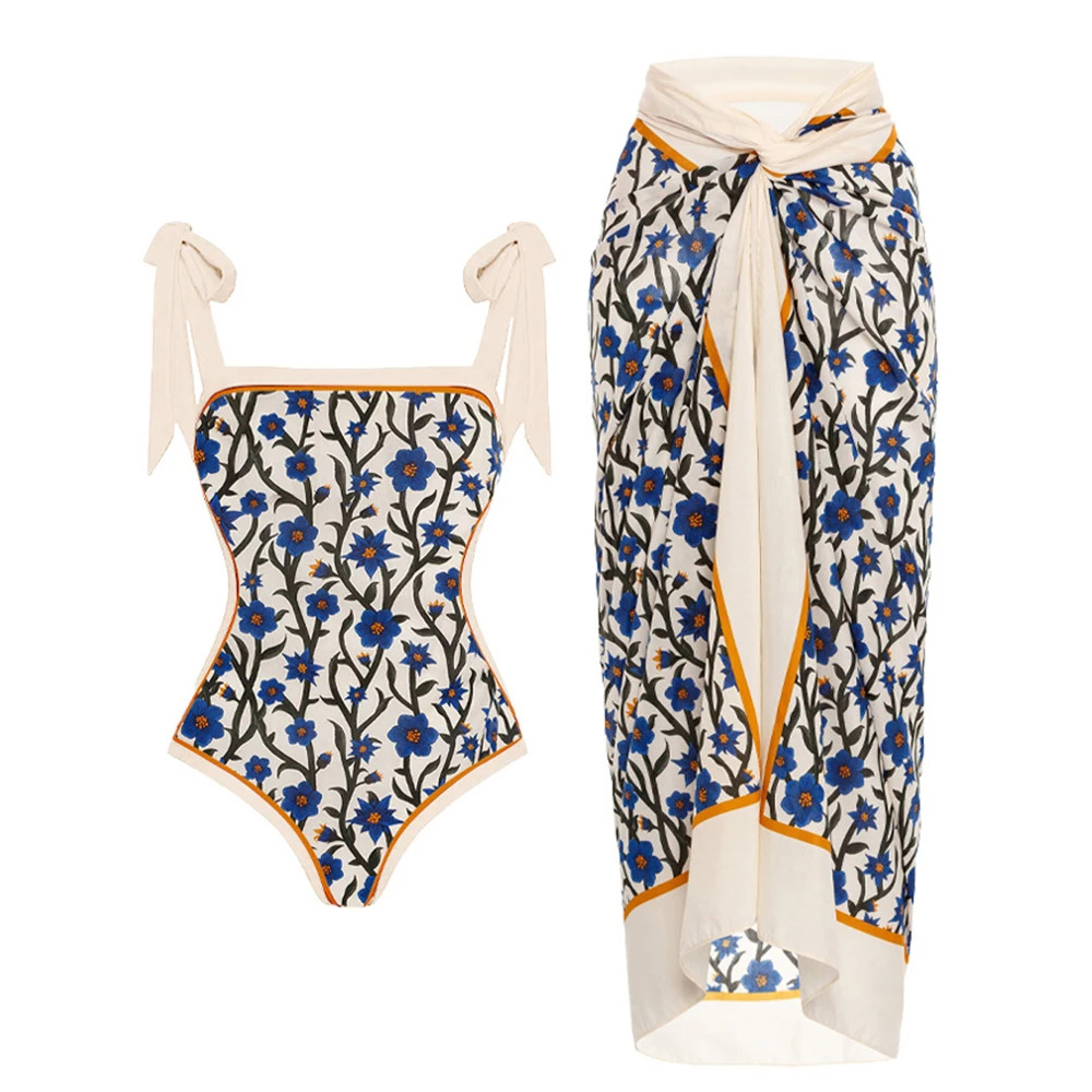 

Women Swimsuits One-Piece Set in White with Blue Floral and Verdant Branch Pattern, Accompanied by a Cover Up