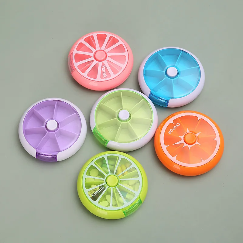 

Round seven grid split medicine box portable transparent 7-day storage box rotary button medicine box