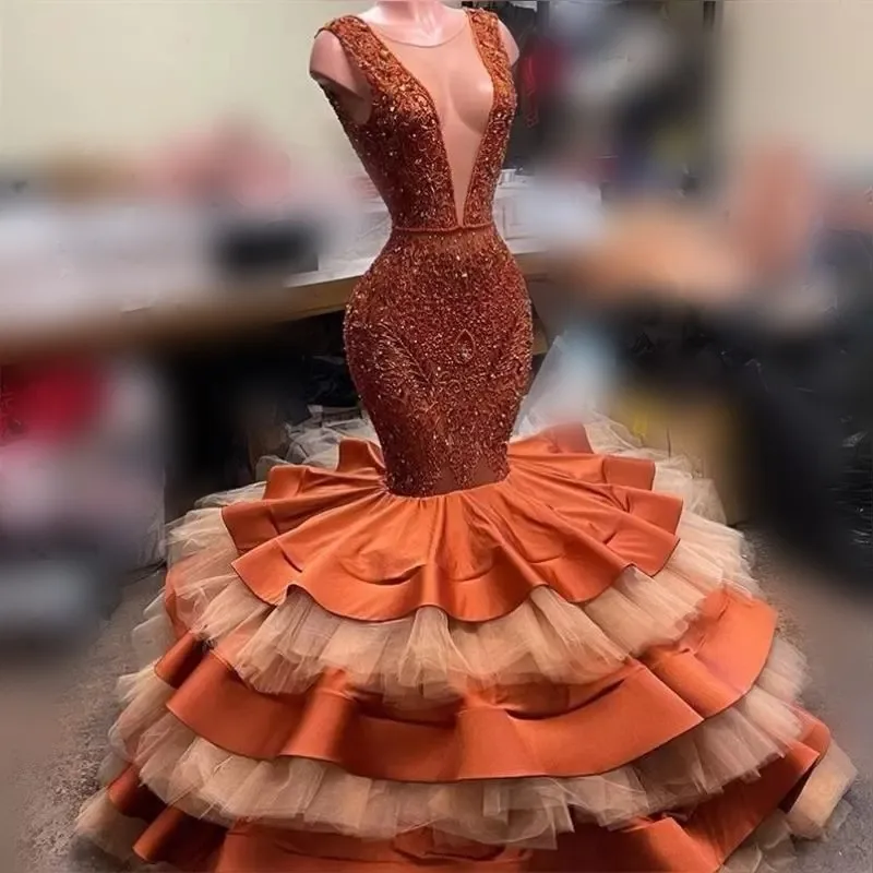 

Orange Tiered Mermaid Prom Dresses Aso Ebi Style Sheer Neck Lace Aleeveless Evening Gowns Satin And Tulle Layers Party Dress