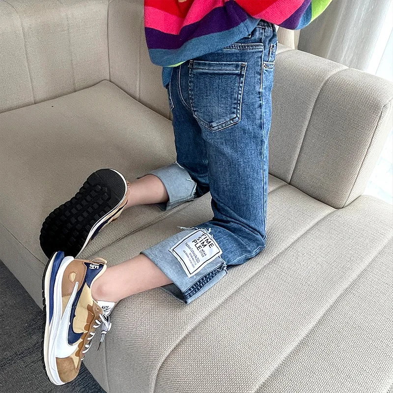 

Girls' straight-leg jeans 2021 autumn new children's cuffed labeling raw edge casual pants