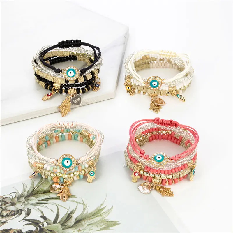 

Wholesale Hot Selling Bohemian Muti-layer Evil Eye Beaded Bracelet Handmade Hamsha Charms Stack Adjustable Bracelet Sets