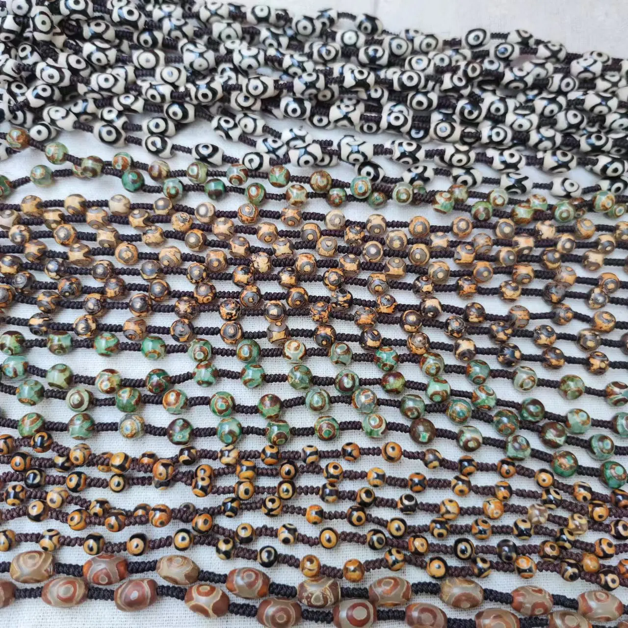 

1pcs/lot natural precious Red green yellow black white three-eyed wealth guardian dzi beads hand-woven rope necklace pendant diy