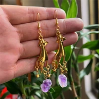 purple crystal hand palm gold long light magic exoteric astrology drop earrings