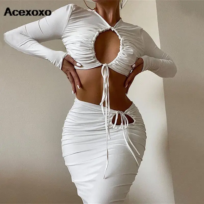 

Europe and the United States new winter sexy solid color hollow long sleeve shirt bundle hip skirt two-piece set