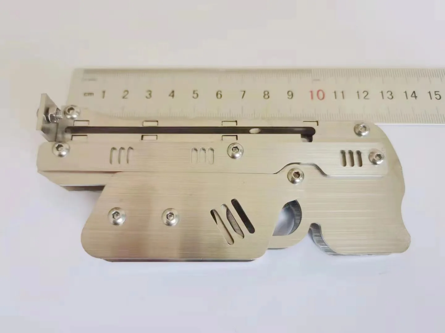 

New mini toy stainless steel folding toy Stainless steel outdoor indoor shooting Mini rubber toy