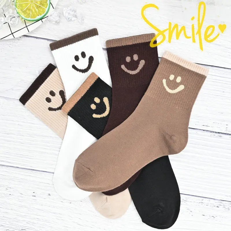 

Smiling face socks women's mid-tube solid color cotton thick section ins tide Korean style cute all-match college style