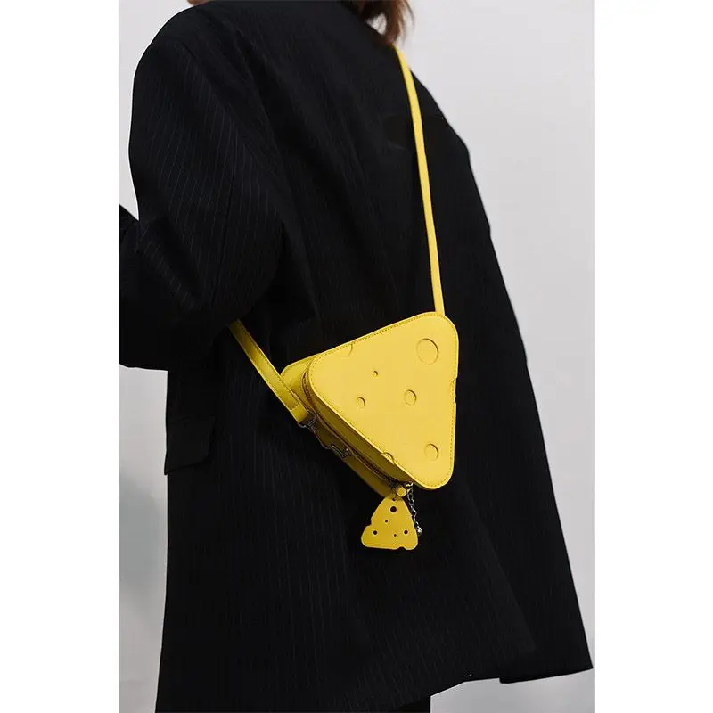 

CIREKJIE niche design outfit cute hole cheese bag triangular lipstick headphone bag crossbody bagTrendy women's bagsAlien