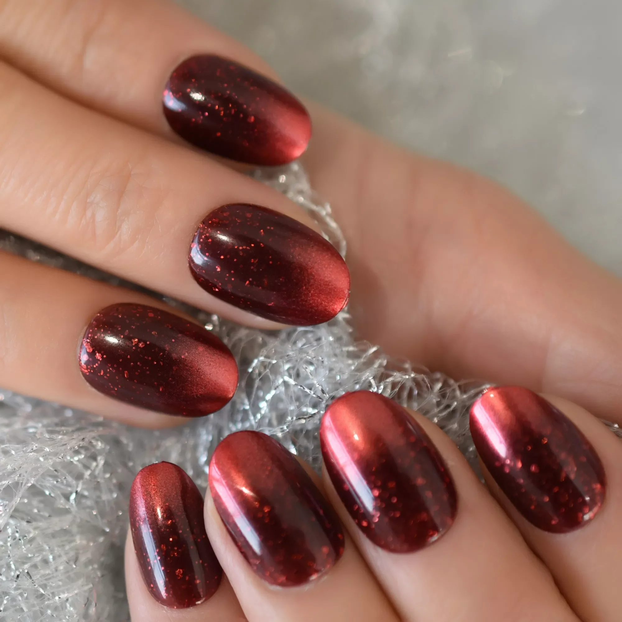 

Dark Red False Nails Medium Length Oval Press On Nail Tips Glitter Galaxy Nail Art with Adhesive Tape