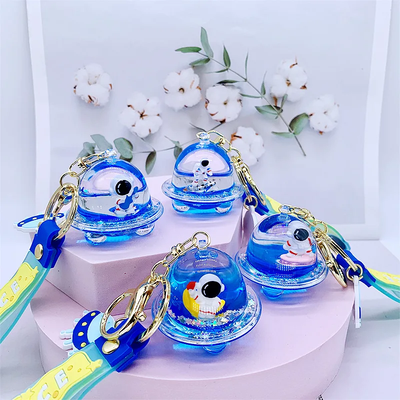 

Cartoon into the Oil Astronaut Liquid Keychain Cute Bag Charm Male and Female Couples Creative Gift Trend Car Key Pendant