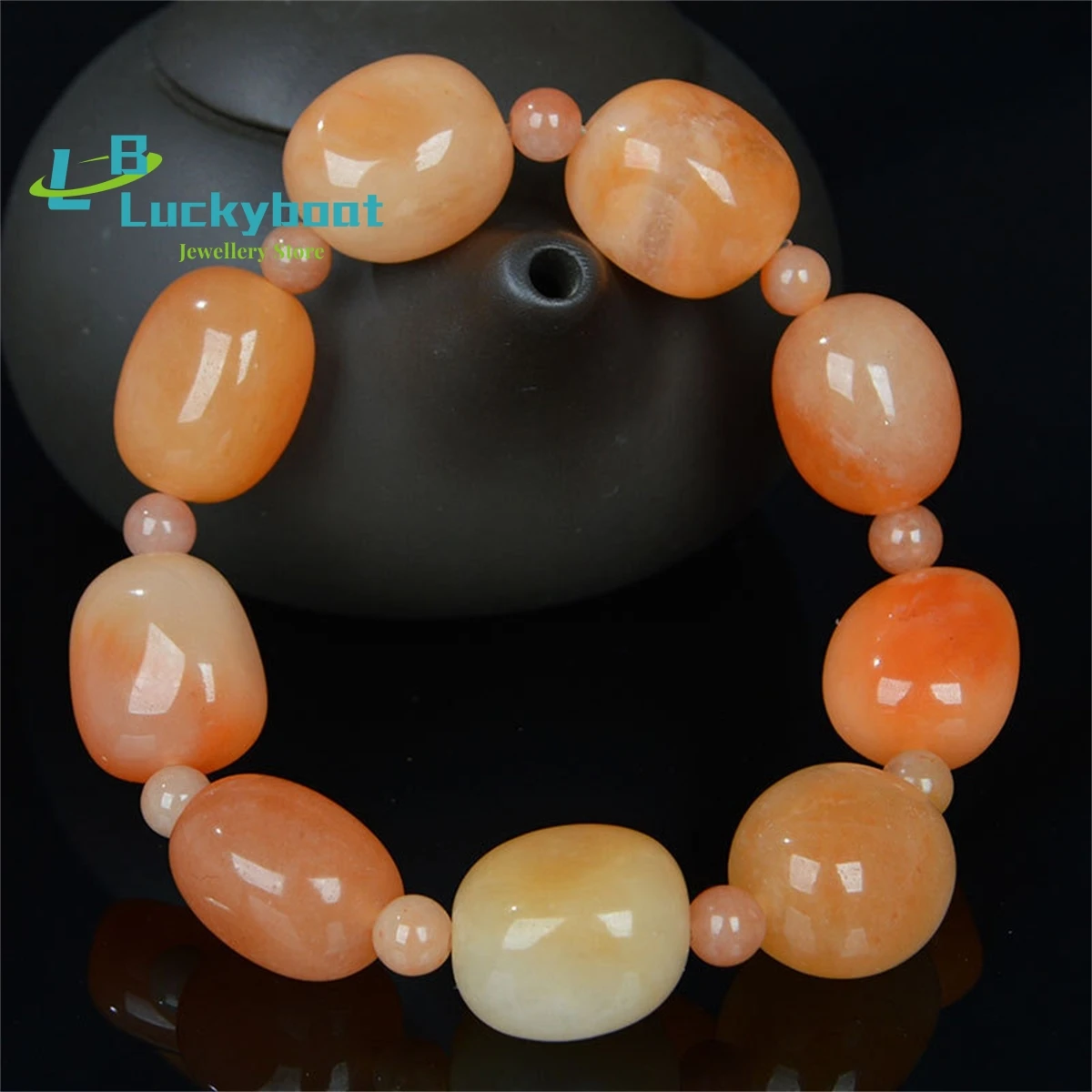 

Wholesale Of Natural Xinjiang Jade Bracelets Gold Silk Colored Seed Materials High-Quality Light Red Gobi Jade Exquisite Jewelry