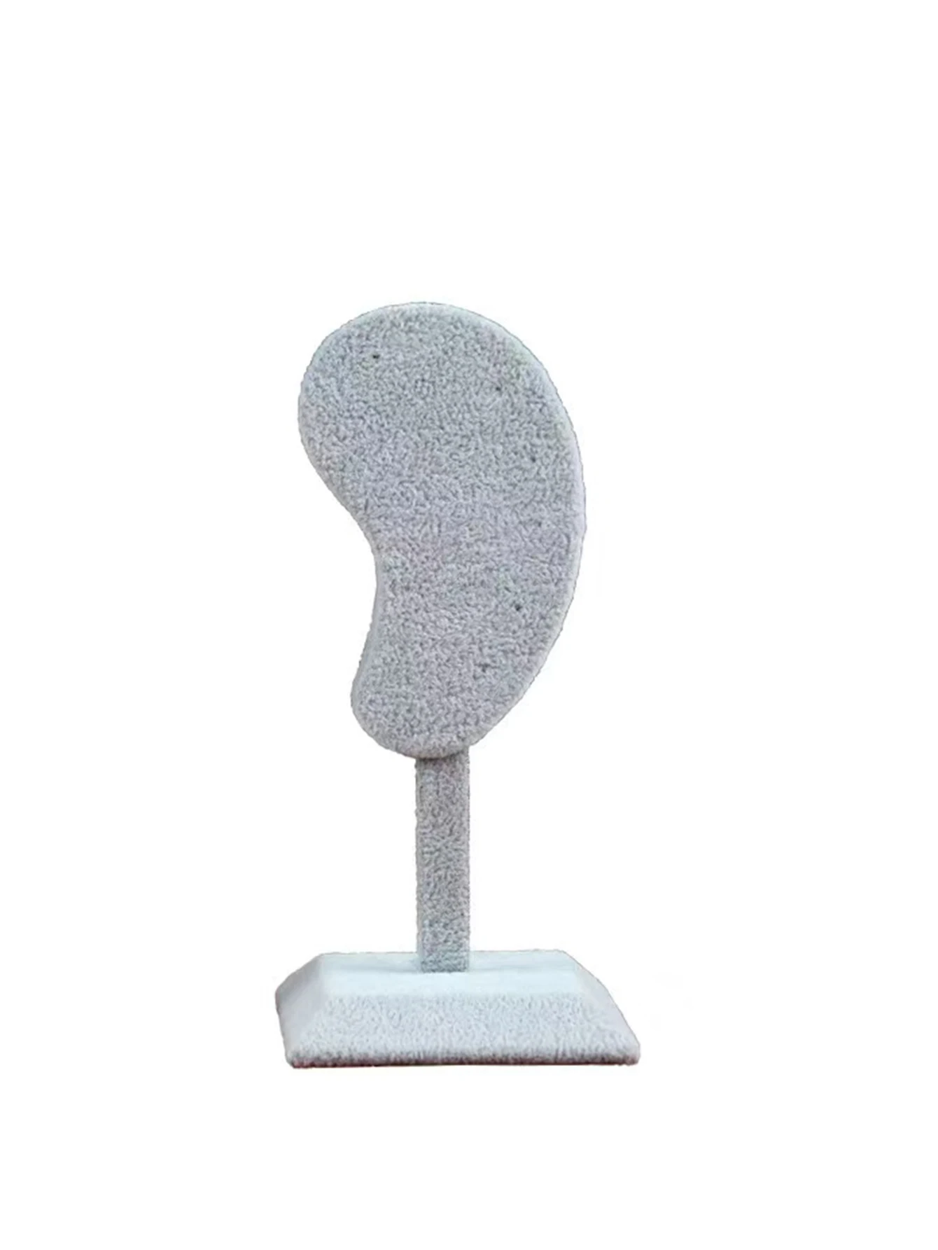 

Подставка для сережек в форме уха из бархата