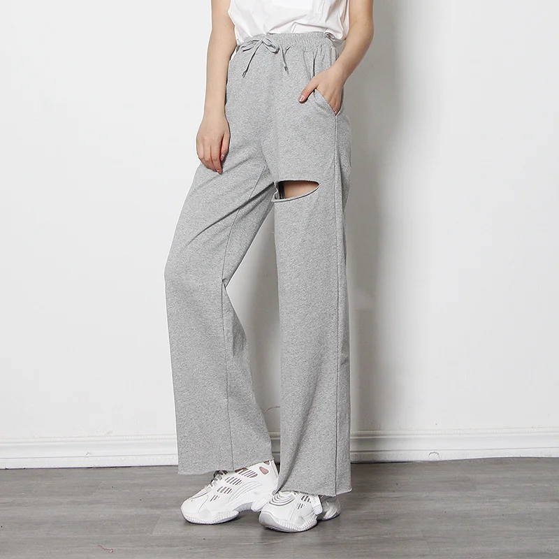 

Новинка весна-лето 2022, свободные повседневные женские брюки, однотонные модные брюки с дырками в Корейском стиле, женские элегантные спорти...