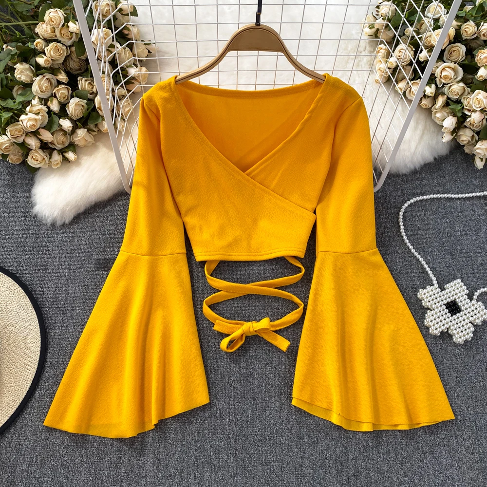 

Clothland Women Sexy V Neck Wrap Blouse Back Lace Up Flare Sleeve Short Style Crop Top Chic Casual Shirt Blusa LA815