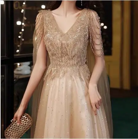 

Champagne Gold Evening Dresses With Cape A Line Sexy V-neck A-line Shiny Luxury Beading Shawl Formal Celebrity Prom Gowns New