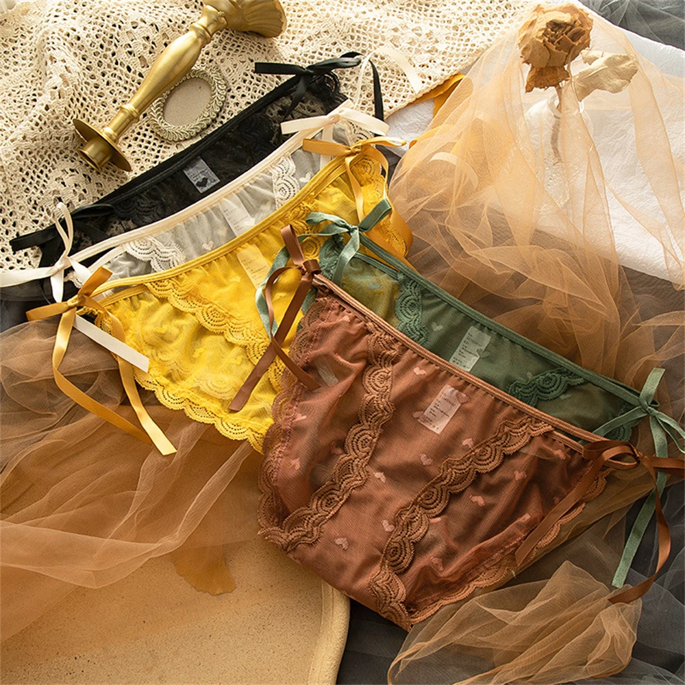 

Женские полностью кружевные трусики с заниженной талией и бантом