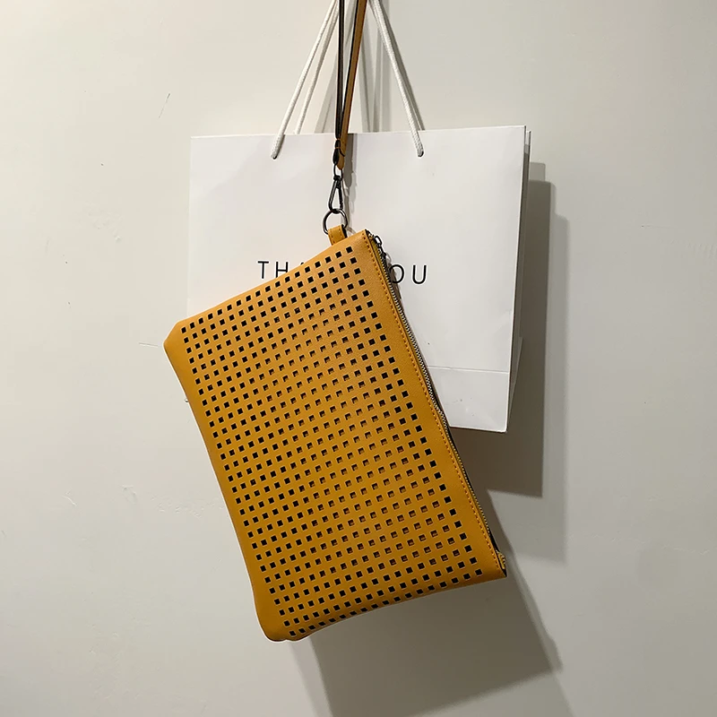 Hand bag simple temperament hollow-out bag female senior texture hand bag fashion envelope bag tide