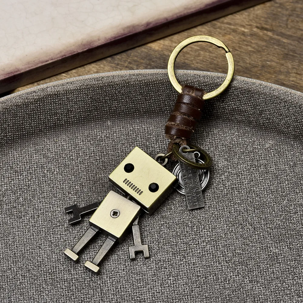 Simple cartoon cute robot cowhide keychain personalized retro woven key pendant creative bag pendant