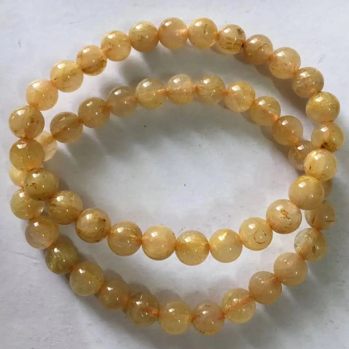 

2bracelets As photo (7) Approx7-7.8mm AKAC natural golden rutile bracelet beads wholesale