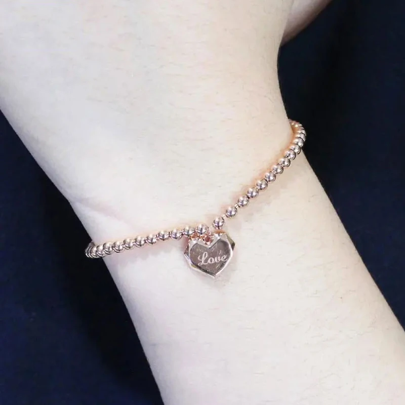 Женский браслет из розового золота 585 пробы с круглыми бусинами