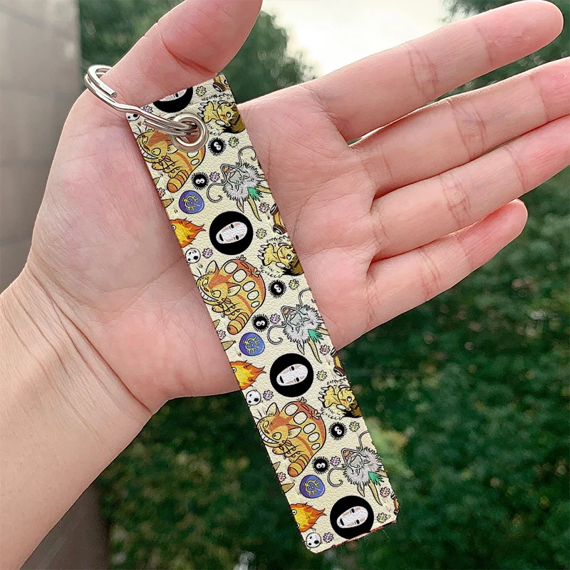 

Fashion Anime Face Leather Keychain Cute Strap Keyrings Hanging Holder Bag Car Wallet Trinket Keychain Hanging Decoration