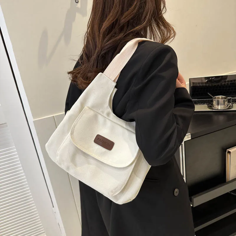 

Trendy New Casual Fashion Simple Temperament Female Ins Niche Design Large Capacity Handheld Canvas Shoulder Diagonal Cross Bag