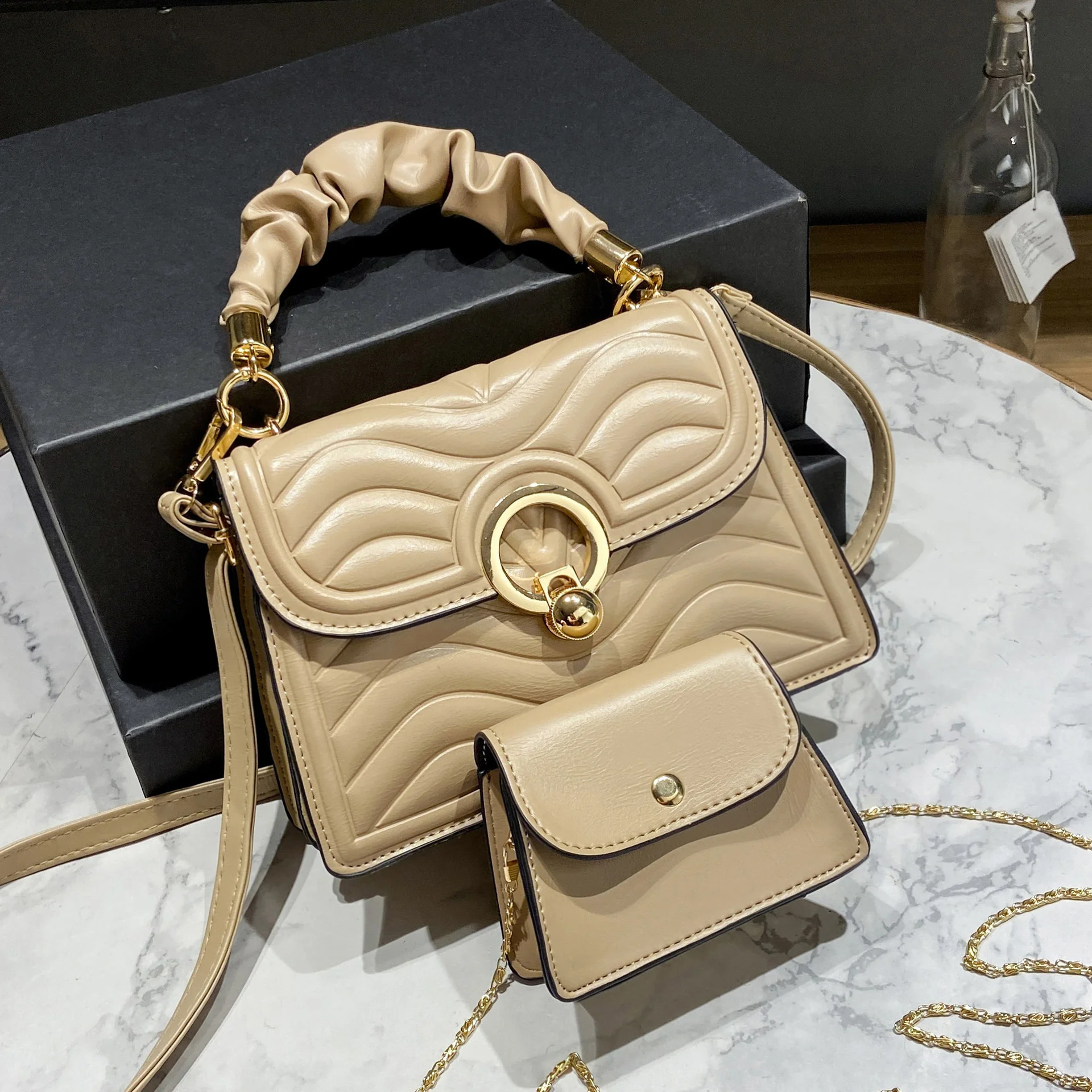 

New embossed simple western-style textured one-shoulder portable small square bun mother bag woman bag
