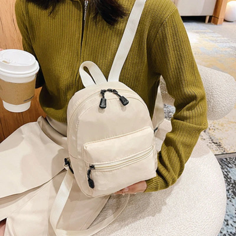 

Мини женские рюкзаки 2022 трендовая нейлоновая женская сумка маленькие школьные сумки белый рюкзак для девочек-подростков Модный повседневн...