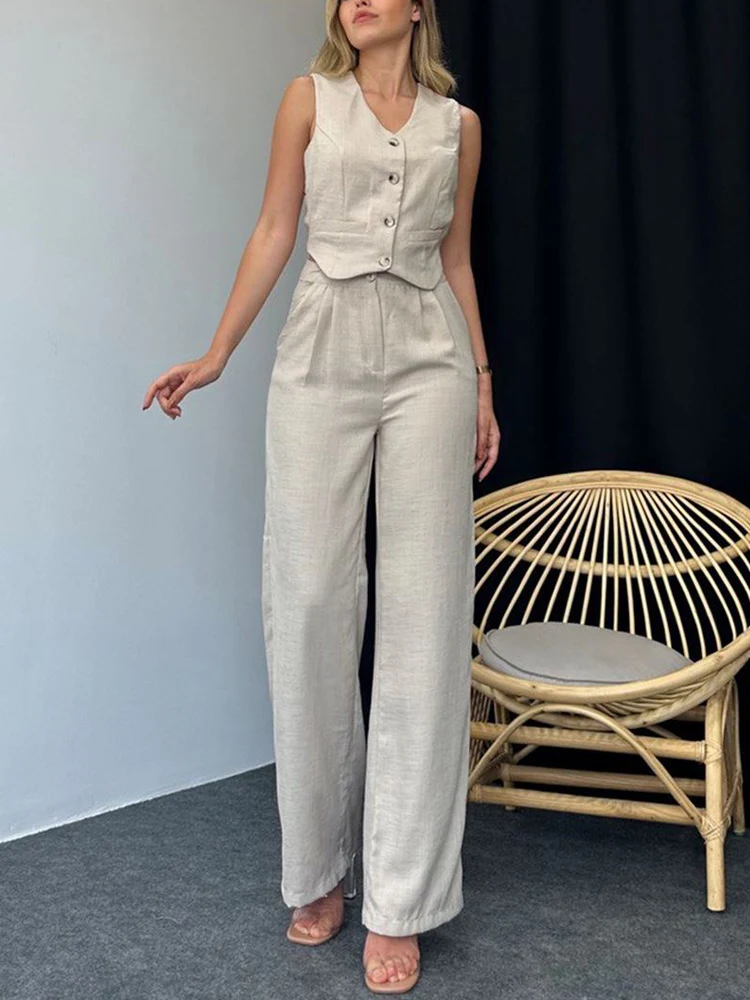 Женский брючный костюм из двух предметов элегантный офисный зеленого цвета с