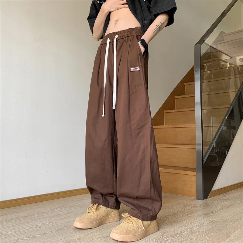 

Брюки-карго мужские на шнуровке, уличная одежда, повседневные однотонные брюки-султанки с эластичным поясом, с множеством карманов, модель A57, весна