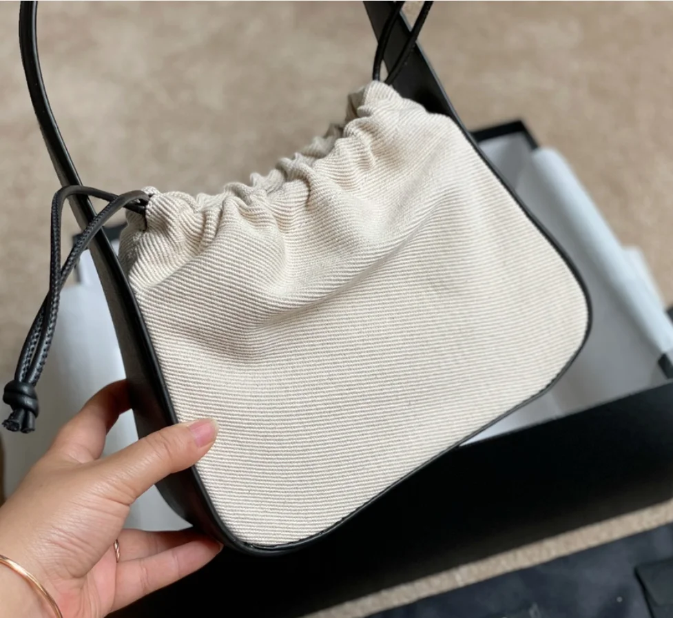114952 Designer Luxury Fashion Classic Luxury Drawstring Canvas Bag Stitched Leather Underarm Bag One Shoulder Handbag A2